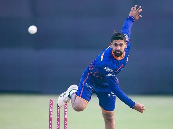 Raghu Sharma bowling leg spin for Mumbai Indians during IPL debut match against Chennai Super Kings